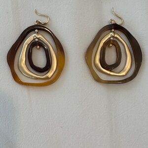 2 1/2” plastic earrings.  Brown and gold.